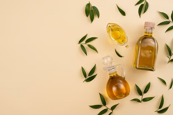 Arrangement vue de dessus avec de l'huile d'olive et des feuilles